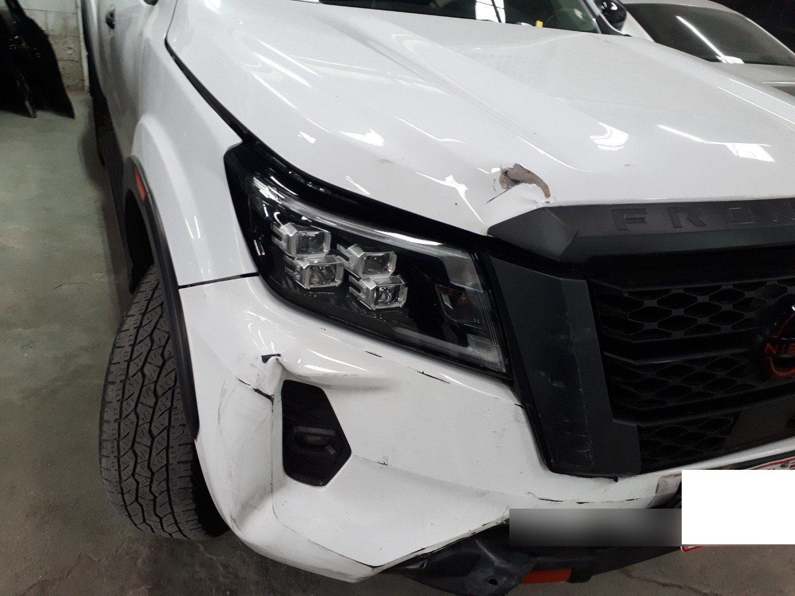 Nissan Frontier — Reparación de frente y parachoques — antes de la reparación